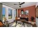 Cozy study with large window, hardwood floors, area rug, and a stylish desk, perfect for remote work at 17020 Cercis Loop, Clermont, FL 34711