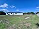 This expansive backyard is partially fenced at 4300 Meadow Ridge Ave, Mulberry, FL 33860