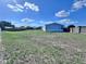 This expansive backyard is partially fenced, offering space for outdoor activities at 4300 Meadow Ridge Ave, Mulberry, FL 33860