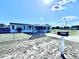 Cozy home with a well-maintained lawn, fenced yard, and a numbered mailbox at 4300 Meadow Ridge Ave, Mulberry, FL 33860