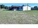 Charming single Gathering home featuring a screened lanai, covered carport, and lawn at 4300 Meadow Ridge Ave, Mulberry, FL 33860