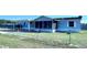 This cozy home features a screened lanai and a beautiful yard, fully fenced at 4300 Meadow Ridge Ave, Mulberry, FL 33860