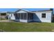 Charming single Gathering home featuring a screened lanai and spacious carport at 4300 Meadow Ridge Ave, Mulberry, FL 33860