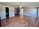 Large open living room with natural light, new vinyl floors and open doorway to hallway and bedrooms at 4300 Meadow Ridge Ave, Mulberry, FL 33860