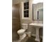 Bathroom featuring a pedestal sink and a large mirror at 6726 Nw 54Th Loop, Ocala, FL 34482