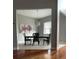 Formal dining room featuring modern chandelier and neutral color palette at 6726 Nw 54Th Loop, Ocala, FL 34482