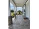 Charming front porch with stone columns and tiled flooring at 6726 Nw 54Th Loop, Ocala, FL 34482