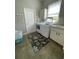 Functional laundry room with washer, dryer, sink, and window at 6726 Nw 54Th Loop, Ocala, FL 34482