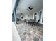 Spacious outdoor patio with ceiling fans, dining table and grill area at 6726 Nw 54Th Loop, Ocala, FL 34482
