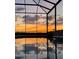 An in-ground pool sits ready for a twilight swim with a stunning sunset view at 6726 Nw 54Th Loop, Ocala, FL 34482
