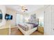 Comfortable bedroom featuring a queen bed, ceiling fan, and ample natural light at 7654 Comrow St # 202, Kissimmee, FL 34747