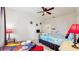 Themed bedroom with bed, decor, and plenty of space at 7654 Comrow St # 202, Kissimmee, FL 34747