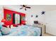 Themed bedroom with bed, decor, and plenty of space at 7654 Comrow St # 202, Kissimmee, FL 34747
