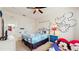 Themed bedroom with bed, decor, and plenty of space at 7654 Comrow St # 202, Kissimmee, FL 34747