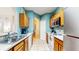 Bright kitchen with stainless steel appliances and tile flooring at 7654 Comrow St # 202, Kissimmee, FL 34747
