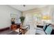 Inviting living room with neutral walls, tile flooring, a glass coffee table, and access to the outdoor patio at 7654 Comrow St # 202, Kissimmee, FL 34747