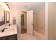 Bathroom featuring a double sink vanity with a dark wood cabinet and a shower with a bathtub at 24 Lake Vista Way, Ormond Beach, FL 32174