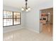 Inviting dining area with view of the fireplace and tile floors perfect for entertaining at 24 Lake Vista Way, Ormond Beach, FL 32174