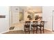 Open kitchen view with breakfast bar, stainless steel appliances and tile flooring at 24 Lake Vista Way, Ormond Beach, FL 32174