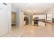 Bright kitchen featuring stainless steel appliances, white cabinetry, and tile flooring for a modern feel at 24 Lake Vista Way, Ormond Beach, FL 32174