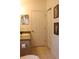 Functional bathroom featuring a single vanity, neutral tones, and tile floors at 1048 Winding Water Way, Clermont, FL 34714