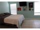 Comfortable bedroom features natural light, neutral tones, and minimalist decor for a relaxing retreat at 1048 Winding Water Way, Clermont, FL 34714