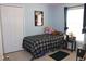 Serene bedroom features a cozy twin bed, a built-in closet, and a window offering natural light and a comfortable feel at 1048 Winding Water Way, Clermont, FL 34714