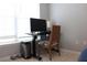 Functional workspace in a bedroom with natural light and tile flooring at 1048 Winding Water Way, Clermont, FL 34714