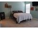 Comfortable bedroom features natural light, neutral tones, and minimalist decor for a relaxing retreat at 1048 Winding Water Way, Clermont, FL 34714