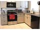 Well-lit kitchen featuring granite countertops, stainless steel appliances, and ample cabinet space at 1048 Winding Water Way, Clermont, FL 34714