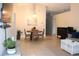 Open-concept living and dining area with tile flooring and plenty of natural light at 1048 Winding Water Way, Clermont, FL 34714