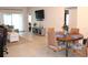 Open-concept living and dining area with tile flooring and plenty of natural light at 1048 Winding Water Way, Clermont, FL 34714