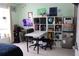 Bright office space featuring a white desk, shelves, and ample natural light for a productive work environment at 1048 Winding Water Way, Clermont, FL 34714