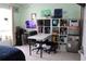 Bright office space featuring a white desk, shelves, and ample natural light for a productive work environment at 1048 Winding Water Way, Clermont, FL 34714