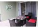Cozy outdoor patio with seating and a sliding door, perfect for relaxation at 1048 Winding Water Way, Clermont, FL 34714
