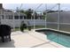 Relaxing screened-in pool area with ample deck space and privacy fencing at 1048 Winding Water Way, Clermont, FL 34714