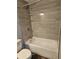 Modern bathroom featuring a tub, shower, tile surround, and in-wall shelves at 1121 W 9Th St, Lakeland, FL 33805