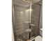 Bathroom with a modern glass shower, pebble flooring, and contemporary fixtures, providing a spa-like experience at 1121 W 9Th St, Lakeland, FL 33805