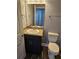 Bathroom featuring a vanity with a modern sink and a toilet, finished with sleek fixtures at 1121 W 9Th St, Lakeland, FL 33805