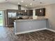 Modern kitchen with stainless steel appliances, stylish countertops, and dark wooden flooring at 1121 W 9Th St, Lakeland, FL 33805