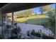 Back patio, featuring a brick floor with potted plants, a pergola, and a beautifully maintained lawn at 16325 Magnolia Bluff Dr, Montverde, FL 34756