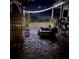 Cozy backyard patio with brick pavers, decorative lighting, and a fire pit perfect for outdoor gatherings at 16325 Magnolia Bluff Dr, Montverde, FL 34756