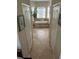 Bright bathroom featuring a bathtub with a view, neutral tile, and ample natural light at 16325 Magnolia Bluff Dr, Montverde, FL 34756