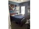 This blue bedroom is decorated with Star Wars posters at 16325 Magnolia Bluff Dr, Montverde, FL 34756