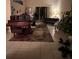 Open-concept living room with tile flooring, large windows, piano, and comfortable seating at 16325 Magnolia Bluff Dr, Montverde, FL 34756