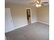 Bedroom featuring neutral-colored walls and carpet with door leading to the bathroom at 2414 Willow Oak Dr, Edgewater, FL 32141