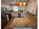 Well-lit kitchen with granite counters, stainless appliances, and ample cabinet space at 2414 Willow Oak Dr, Edgewater, FL 32141