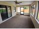 Enclosed lanai with ample natural light and access to the backyard at 2414 Willow Oak Dr, Edgewater, FL 32141
