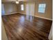 Spacious living room with hardwood floors, plenty of natural light, and ceiling fan at 2414 Willow Oak Dr, Edgewater, FL 32141