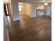 Open-concept living area with modern flooring and a view of the kitchen at 2414 Willow Oak Dr, Edgewater, FL 32141
